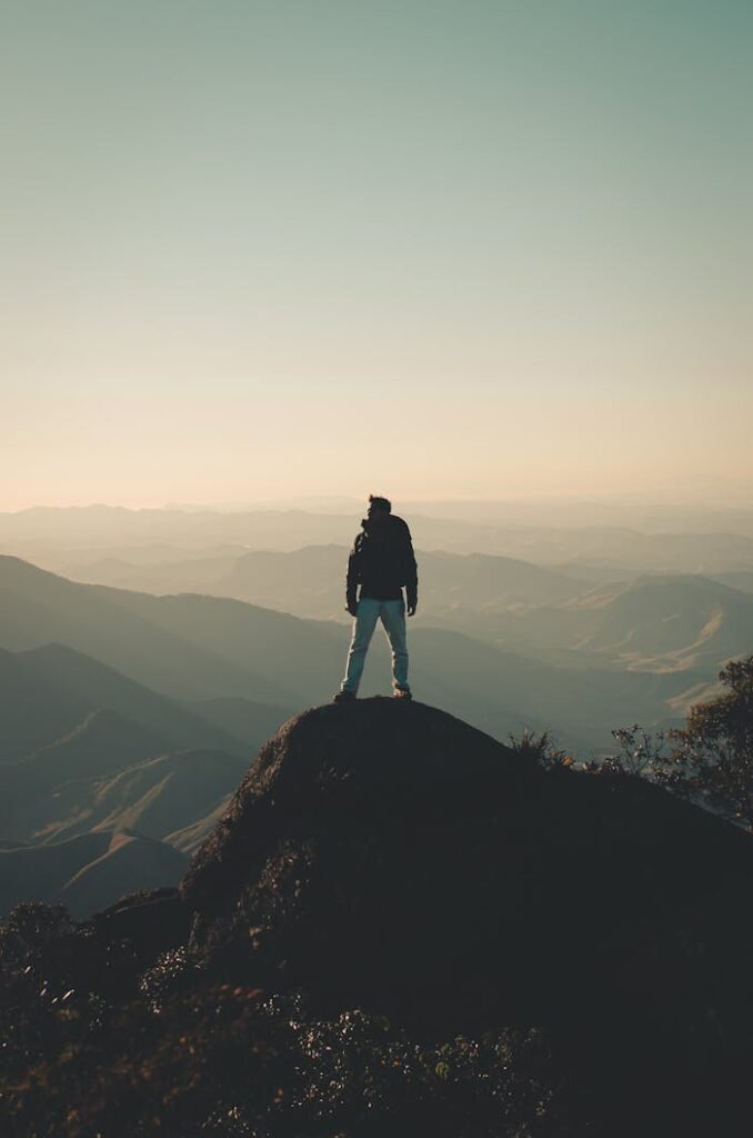 Photo Of Man Standing On Hill